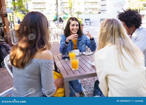 Multi Ethnic Group Of Friends Having A Drink Together In An Outdoor Bar Stock Image Image Of