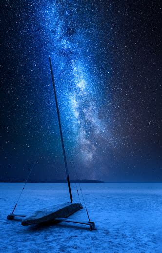 Milky Way Over Ice Boat On Frozen Lake At Night Stock Photo Download