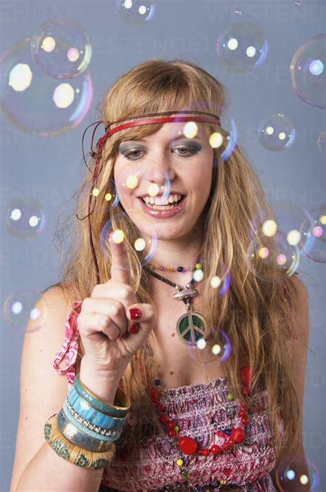 Young Hippie Woman With Bubbles Against Grey Background Smiling Stock
