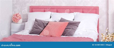 Stylish Interior Of Modern Bedroom White And Pink Design Of Cozy Bedroom With Flowers Stock