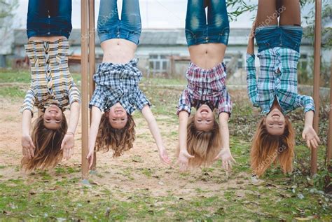 Girls Hanging Upside Down Having Fun Stock Photo By ©rosipro 83702532