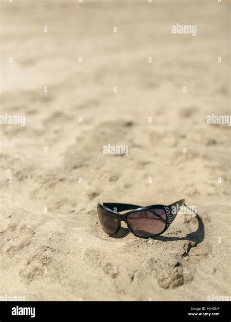 Sunglasses In The Sand Stock Photo Alamy
