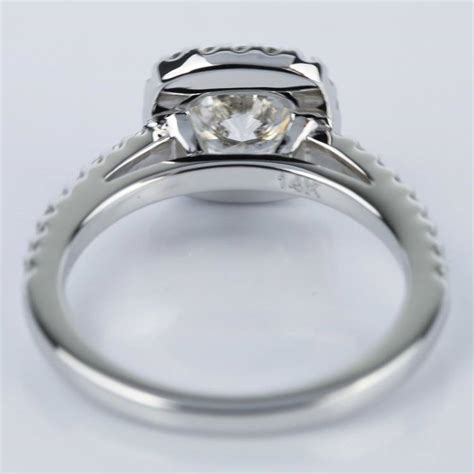 Although we often think of solitaire rings containing round diamonds, keep in mind that one way to add a bit of unexpected glamour to a simple engagement ring is by choosing a fancy shaped diamond. Square Halo 1 Carat Diamond Engagement Ring in White Gold