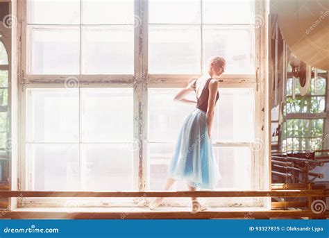 Ballerina Is Dancing In Front Of A Large Window Stock Image Image Of