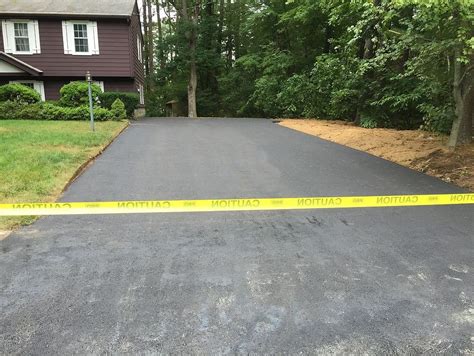 Asphalt driveway with existing grading). Master Paving Corporation | Paving Contractor | Ashland, MA