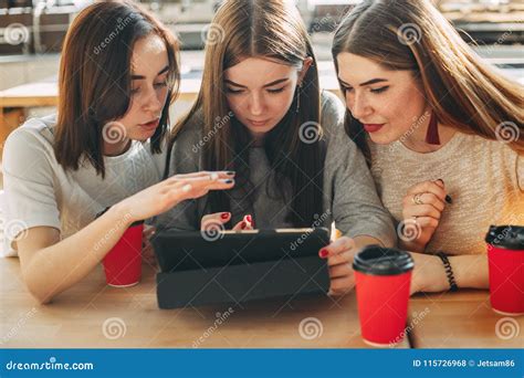 Students Read And Discuss Their Task At Tablet Pc Stock Photo Image