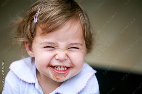 Lovely Little Girl Making Funny Face Stock Photo Adobe Stock