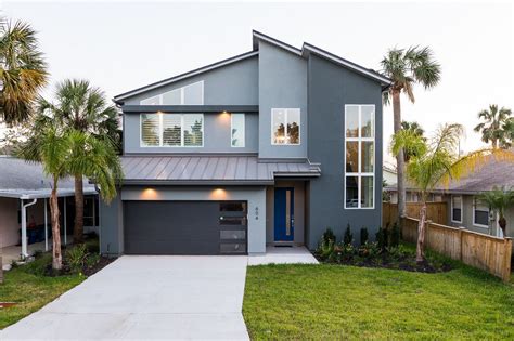 You may feel proud of your garage door and want to make it you can also use the interior of your home to inspire color ideas for your exterior. Modern Beach Custom Home | Garage door design, Modern ...