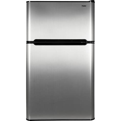 This sleek mini fridge has a roomy interior with multiple storage shelves and a freezer compartment, so it's a great choice for keeping a variety of things cold. Haier 3.2 Cu Ft Two Door Mini Fridge w Freezer HC32TW10SV ...