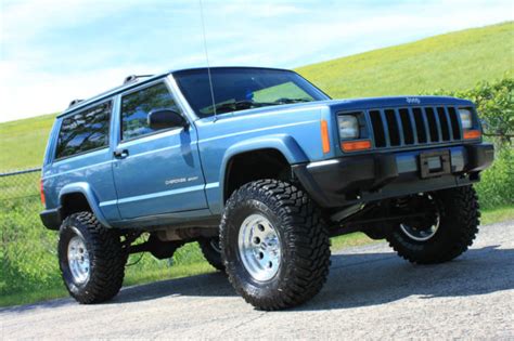 All vehicles are subject to prior sale. 1999 Jeep Cherokee Sport XJ RARE 2 Door Blue 4X4 LIFTED ...