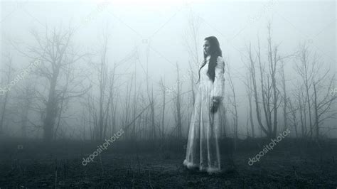 Haunted Female Ghost In The Spooky Forest Stock Photo By ©lariotus 98195852