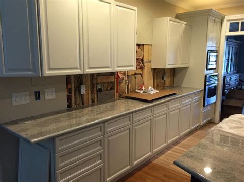 A pinstripe glaze can accentuate the details of the cabinets. China White with Pewter Pinstripe - 2 Cabinet Girls