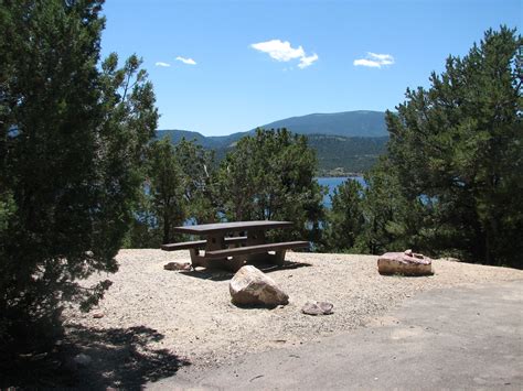 In building these log cabins we have strived to keep each one rustic and unique. Photo of a site at the Mustang Ridge Campground ...