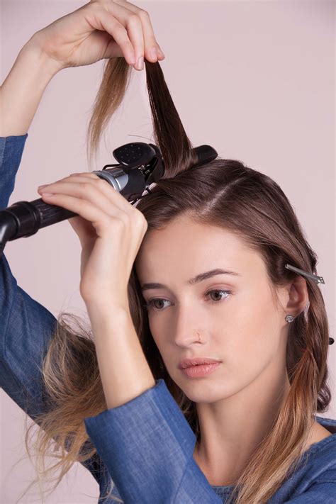 The best way to curl short hair with a curling wand is to work in layers. The curling wand: Your ultimate guide