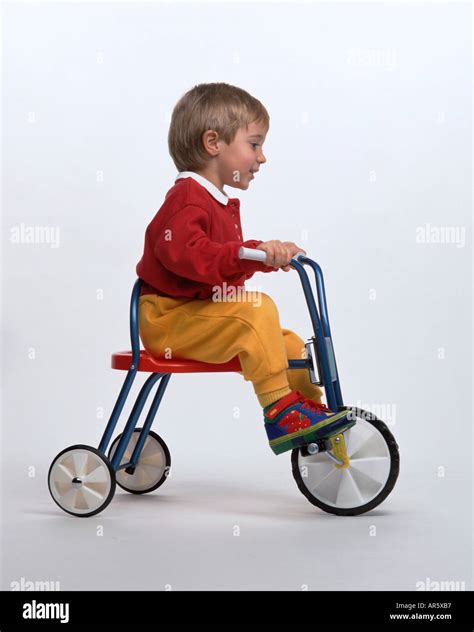 Little Boy On A Tricycle Stock Photo Alamy