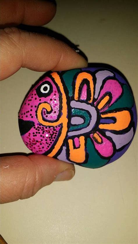 Brightly colored egg is an item used in the noblegarden holiday. Brightly colored tropical fish rock art by ...