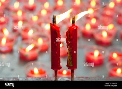 Burning Red Candle At Chinese Shrine For Making Merit In Chinese New