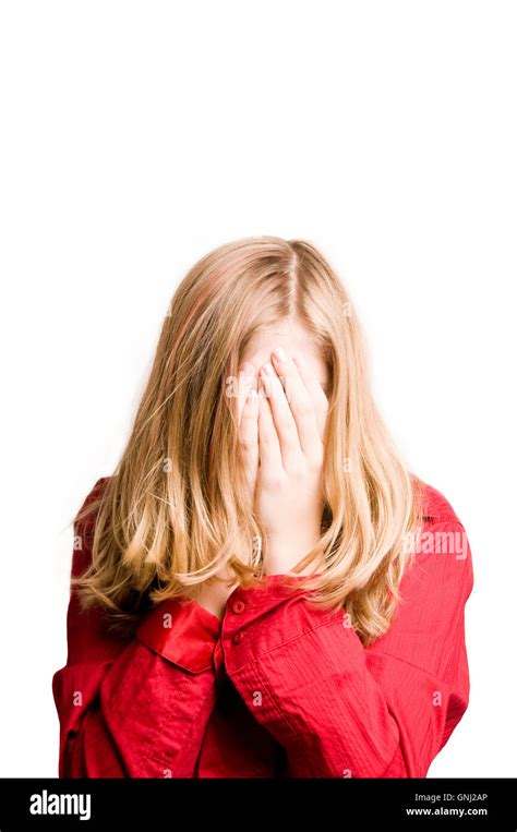 Blond Tween Girl Hiding Her Face Behind Hands Stock Photo Alamy