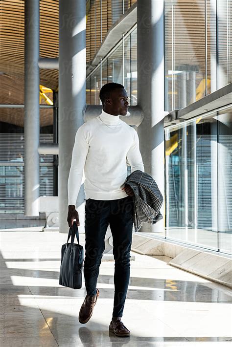 Young Black Businessman Walking At The Airport Terminal Del