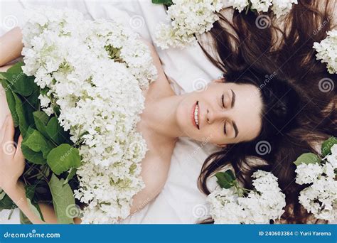 Head Shot Beauty Portrait Of Brunette Woman Lying On White Bed Near