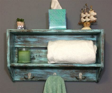 The product has side support rail to move it or keep towels and other items. Nautical bathroom wall shelf with hooks, bathroom shelving ...