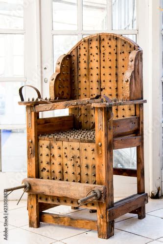 Old Wooden Chair With Spikes For Torture Stock Photo Adobe Stock
