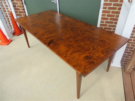 The two table halves open and close in the center allowing for up to three 18 wide table leaves. Tiger Maple Wood Pennsylvania Table - Great Windsor Chairs
