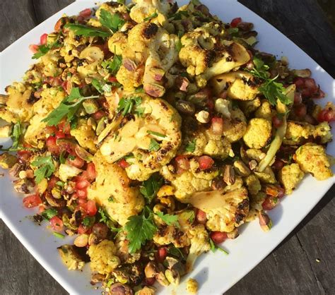 Place the roasted cauliflower back in the bowl and toss with the curry powder. Spiced cauliflower parsley and pomegranate salad with ...