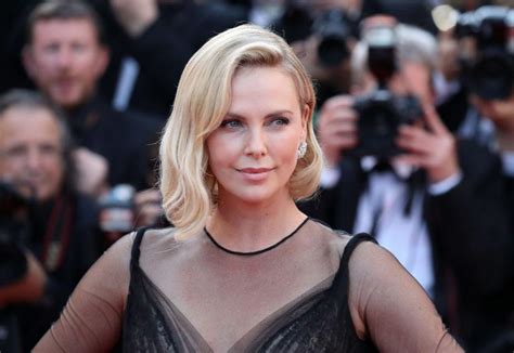 charlize theron responds to critics who think she had a facelift and denies getting bad plastic