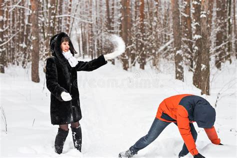 Young Couple Playing In Snow Having Snowball Fight Stock Image Image Of Playful Cold 80130473