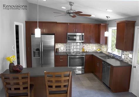 Instead of ripping out what you have, save some money by getting new. Contemporary kitchen remodel by Renovisions. Stainless ...