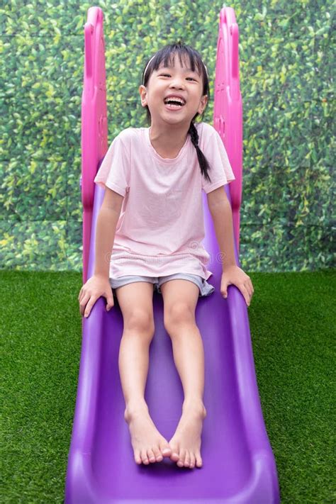 Asian Chinese Little Girl Playing On The Slide Stock Image Image Of