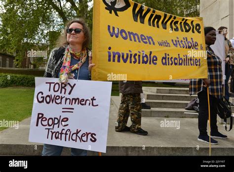 London Uk 26th Apr 2022 A Protester Holds A Placard And Others Hold A Banner Expressing