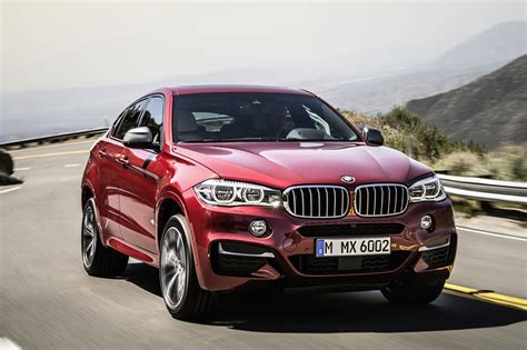 The x6 m adds larger air intakes and lowers the ride height for a more sporty stance. 2015 BMW X6 M Sport - 95 Octane