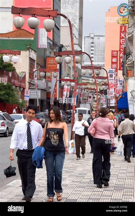 People Walking In The Liberdade Asian Section Of Sao Paulo Brazil Stock