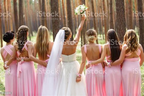 Bride And Bridesmaids In Pink Dresses Having Fun At Wedding Day Happy Marriage And Wedding Party