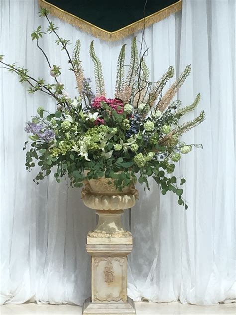Large floral arrangement in urn | Large floral arrangements, Floral arrangements, Floral design