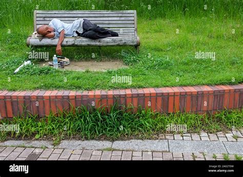 Man Sleeping On A Park Bench In Fukuoka Japan Stock Photo Alamy
