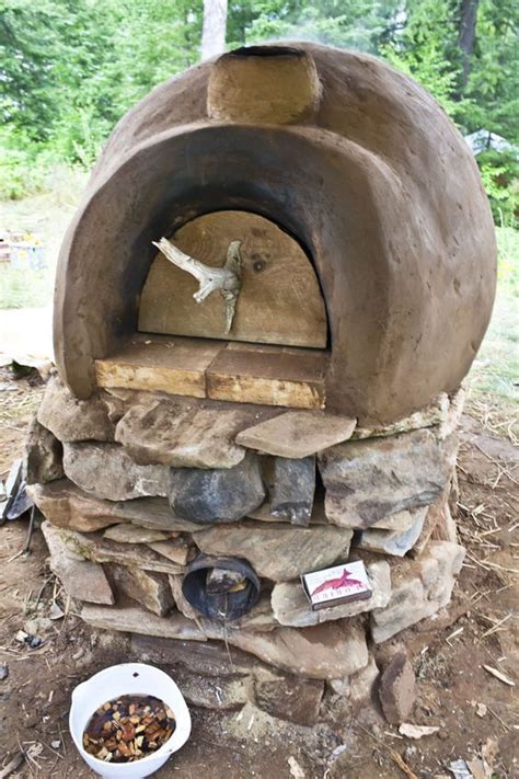 Patio heaters in general can be a bit rough and industrial looking which doesn't go well with every decor style. Build your own earthen oven -- with ROCKET STOVE heating. Brilliant! #homestead | Rocket stoves ...