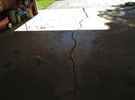 Use a wire brush to remove any dried concrete and debris from the crack. Concrete Driveway Repair & Garage Slab Repair From SKV ...