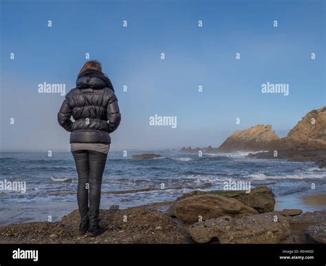 Girl With Her Back Facing The Sea Stock Photo Alamy