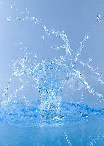 Water Splashing On Top Of A Blue Surface