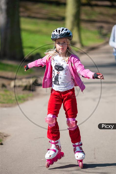 Image Of A Young Girl On Roller Blades Wearing Protective Equipment Id411199 Picxy