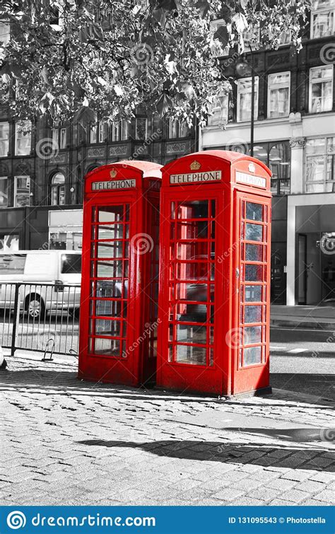 Black And White Photo With Red Telephone Booth At London City Stock