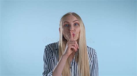 Amazing Blonde Woman Making Silence Gesture On Blue Background Stock