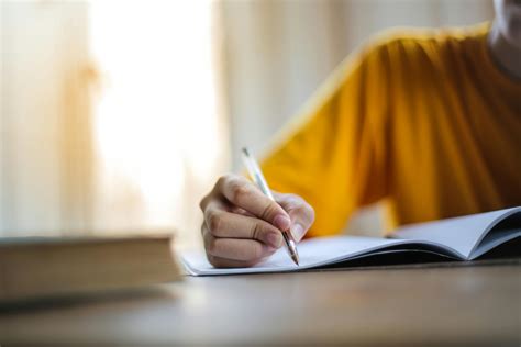 Selective Focus Photo Of Person Writing · Free Stock Photo