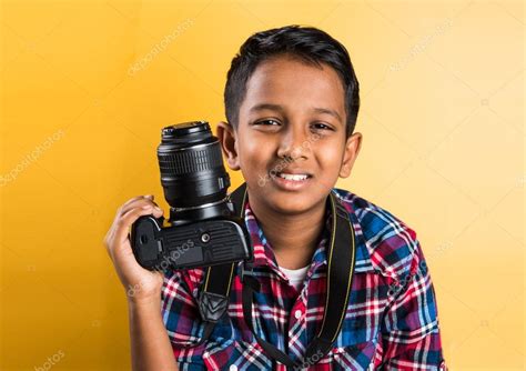The film is also burton's first collaboration with actor johnny depp and cinematographer stefan czapsky. 10 year old indian boy holding digital camera or DSLR ...