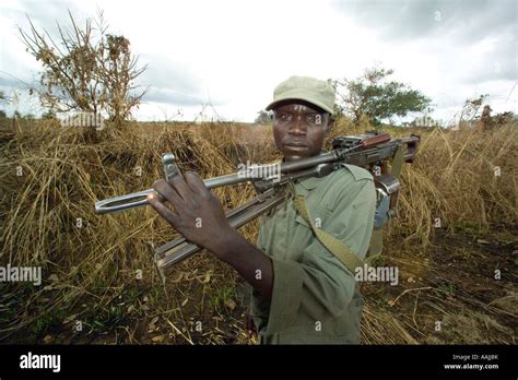 Uganda Peoples Defence Force Soldier With Machine Gun On Patrol