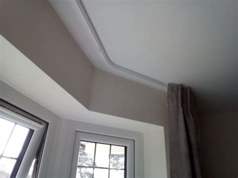 They also have a range of tracks that have been designed to be ceiling recess fitted. bay window curtain tracks that look great and work even better