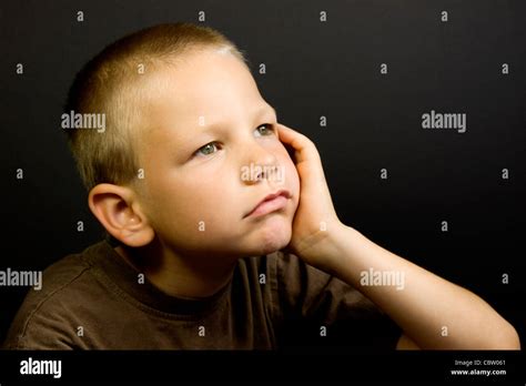 Young Boy Day Dreaming Stock Photo Alamy